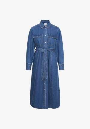 Denimist kett, millel on pikad varrukad, nööpidega ees, kaks rinna taskut, vöödiga talje ja kontrastsete õmblustega detailid. Klassikaline sinine värv.