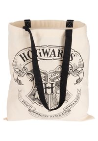 Canvas tote bag featuring a black and white Hogwarts crest design, black fabric straps, and a beige background. Measures approximately 40 cm wide.