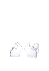 Orecchini a forma di coniglio in argento con una finitura liscia e lucida. Ogni orecchino presenta un design a silhouette stilizzata e linee chiare.