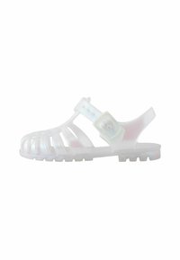 Transparent gelésandaler med utskärningsdesign, justerbart spänne, strukturerad sula och rund tå. Färgen skiftar med ljuset.