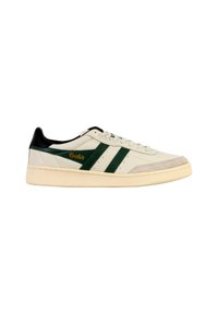 White low-top sneaker with dark green stripes, beige sole, black heel, and "Gola" logo on the side.