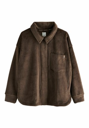 Braune Cordjacke im oversize Schnitt mit Kragen, Frontreißverschluss und einer Brusttasche. Weicher Stoff und lässige Passform.