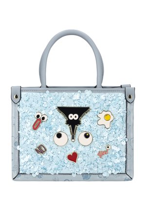 Light blue handbag with sequins and cartoon-style pins including eyes, a heart, an egg, clip, and words "NO" and "yes!"