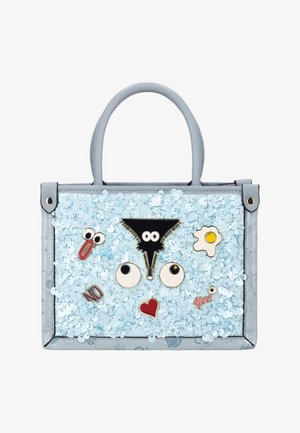 Light blue handbag with sequins and cartoon-style pins including eyes, a heart, an egg, clip, and words "NO" and "yes!"