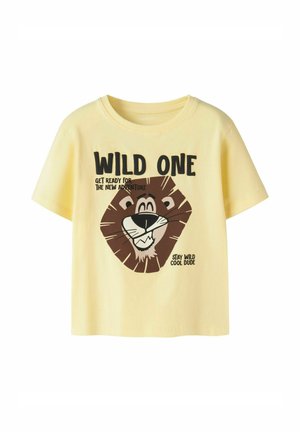 Yellow children's t-shirt with a smiling lion face and black text saying "Wild One" and "Get ready for the new adventure, stay wild cool dude."