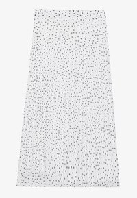 Falda plisada blanca con lunares negros, con una textura suave y una cinturilla ancha. Diseñada para una silueta fluida.