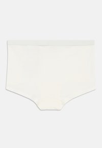 Μάλλινες hipster εσώρουχα σε εκρού, με λεία υφή, φαρδιά ελαστική μέση και απλό, κλασικό σχέδιο.