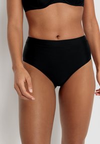 High-waisted black bikini bottoms with a smooth texture and elastic waistband, designed for comfort and full coverage.