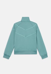 Teal sweatshirt with a high collar and long sleeves. Features contrasting lighter stitching in a chevron pattern on the back.