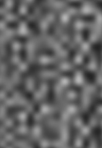 Abstraktní texturovaný povrch s různými vyvýšenými geometrickými tvary v odstínech šedé. Materiál vypadá, že má hladký povrch.