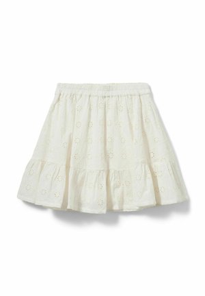 Jupe blanche en coton avec ceinture élastique, motif floral brodé ajouré et ourlet à volants.