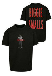 Svart bomulls t-skjorte med et frontgrafikk av en person og rød tekst "THE NOTORIOUS B.I.G." og "BIGGIE SMALLS" trykt på baksiden.