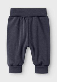 Mörkgrå bomullsbyxor med elastisk midja, samlade muddar och en mjuk struktur. Utformade utan fickor, med fokus på komfort och enkelhet.