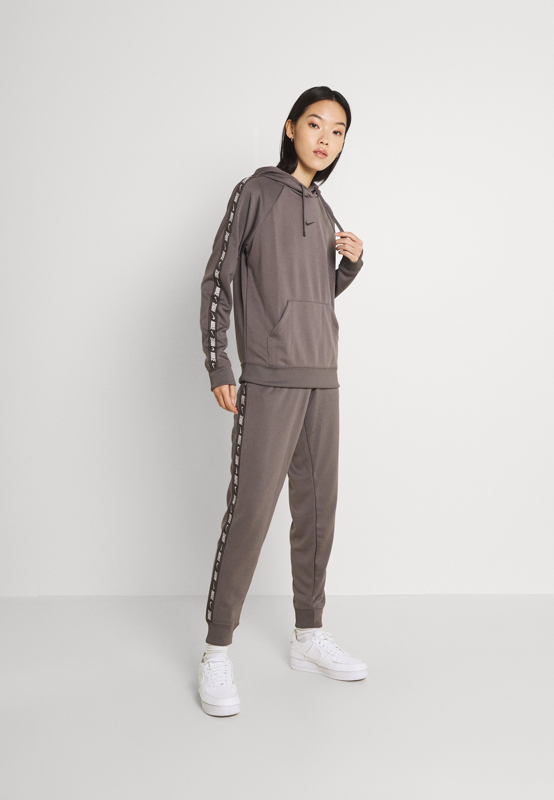 Nike taped tracksuit bottoms Clearance