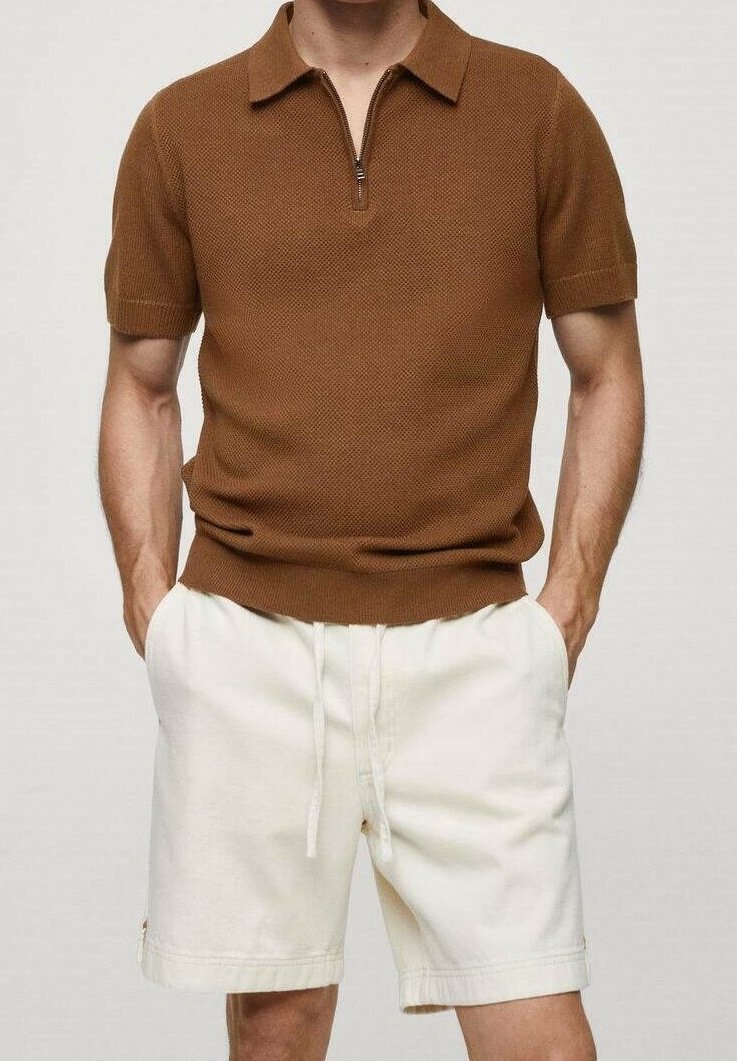 Brown knit polo shirt with short sleeves and a zippered collar, paired with white drawstring shorts. Cotton fabric with textured pattern.