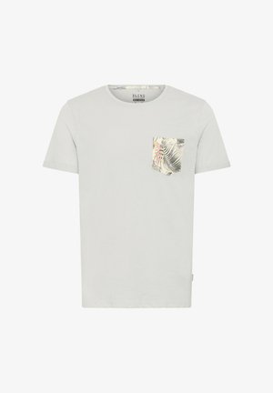 Light grey t-shirt made of soft cotton, featuring a round neck and a colorful palm leaf-patterned pocket on the left chest.