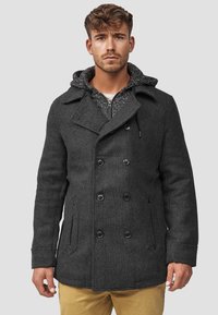 Grijze wollen peacoat met dubbele knopen, voorzien van een capuchon en een gestructureerde voering. Zakken aan de zijkanten en een stevig ontwerp.