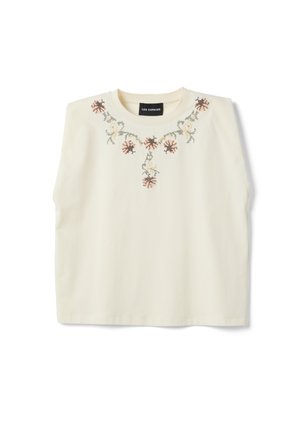 Cream sleeveless top with round neckline, featuring embroidered floral and vine patterns across the chest and shoulders.