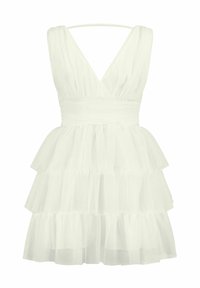 Robe blanche à volants en tulle, avec un décolleté en V profond, des fines bretelles et une taille cintrée. Design léger et aéré.