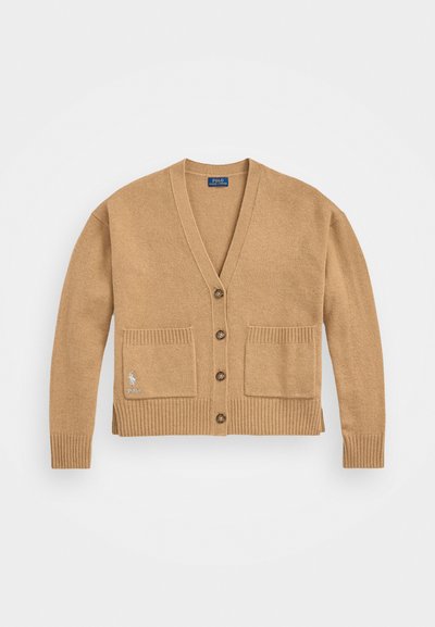 Beige knitted cardigan with a V-neck, button closure, ribbed cuffs and hem, and two front pockets. Features a logo on the left pocket.