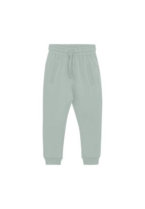 Heledad rohelised dressipüksid pehmest kangast, kus on elastne vöökoht, nöör ja kaks külgtaskut. Kõrvale on lisatud mansetid.