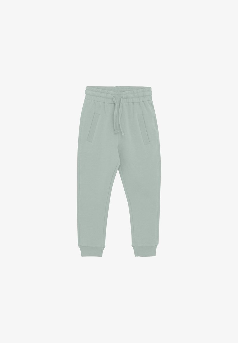 Gaiši zaļi treneri, kas izgatavoti no mīksta auduma, ar elastīgu jostasvietu, auklu un divām sānu kabatām. Ar piegrieztiem potīšu galiem, kas pabeidz dizainu.