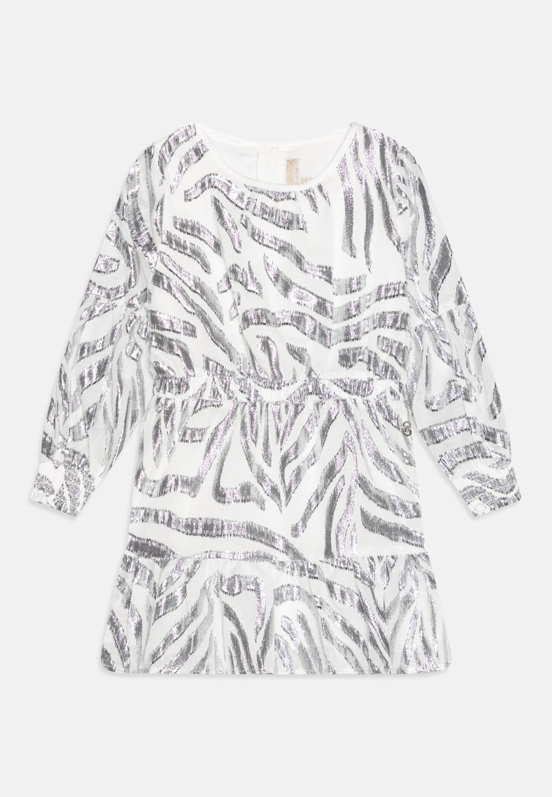 Long-sleeve white blouse with silver zebra stripe pattern, gathered waist, and ruffled hem. Soft, lightweight fabric with shiny accents.