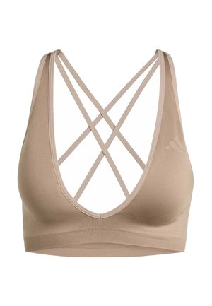 Beiger Sport-BH mit gerippter Band und dünnen, überkreuzten Trägern am Rücken, mit einem dezenten Logo auf der linken Seite.
