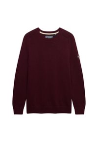 Burgundy knitted long-sleeve crew neck sweater with ribbed cuffs and hem, Superdry brand label at neck and small patch on left sleeve.