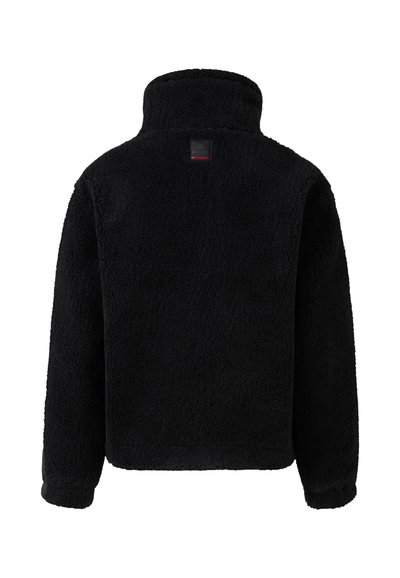 Black fleece jacket with a high collar, featuring a soft, textured surface and a square label near the neck. Simple, solid color design.