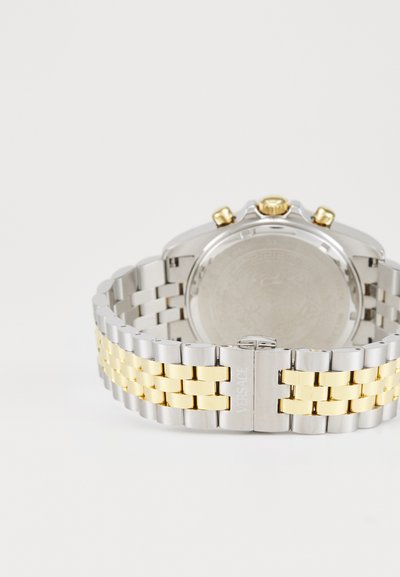 Silver and gold-tone metal watch with a link bracelet; round case; three crown buttons; smooth back; engraved brand detail.
