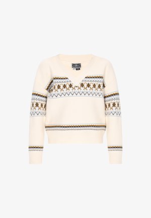 Krémový pletený svetr s výstřihem do V, který má geometrické vzory v rezavé, zlaté a šedé barvě na hrudi a rukávech.