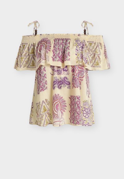 Robe crème épaules dénudées avec motifs patchwork floraux et paisley en violet, rose et or et bretelles à nouer avec des perles en bois.