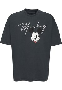 Camiseta de gran tamaño en gris oscuro, fabricada en algodón, que presenta un gráfico de Mickey Mouse sonriente y la palabra "Mickey" en texto cursivo blanco.