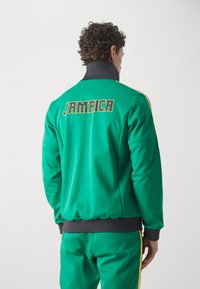 adidas Originals JAMAICA JFF BECKENBAUER TRACK - Equipación de selecciones - court green