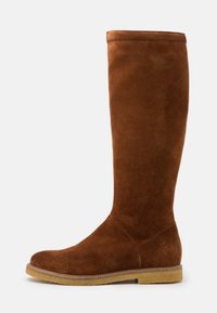 Brown suede knee-high boot with a rounded toe, flat sole, and subtle stitching detail. Smooth texture and simple design without embellishments.