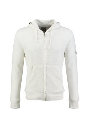Weißer Waffelstrick-Kapuzenpullover mit Reißverschluss, Vordertaschen und Kordelzug am Kapuzen, gezeigt vor einem schlichten weißen Hintergrund.