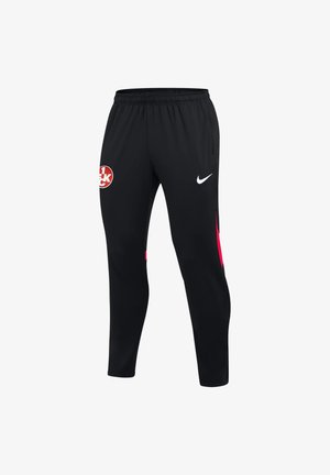 Schwarze Sporthose mit elastischem Bund, Nike-Logo am rechten Oberschenkel, rotes und weißes rundes Emblem am linken Oberschenkel und rote Akzente an den Seiten.