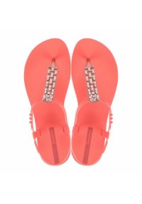 Infradito corallo con suola testurizzata, dotati di una fascia decorata con gemme e un listello anteriore liscio. Design flat con dettagli a contrasto.