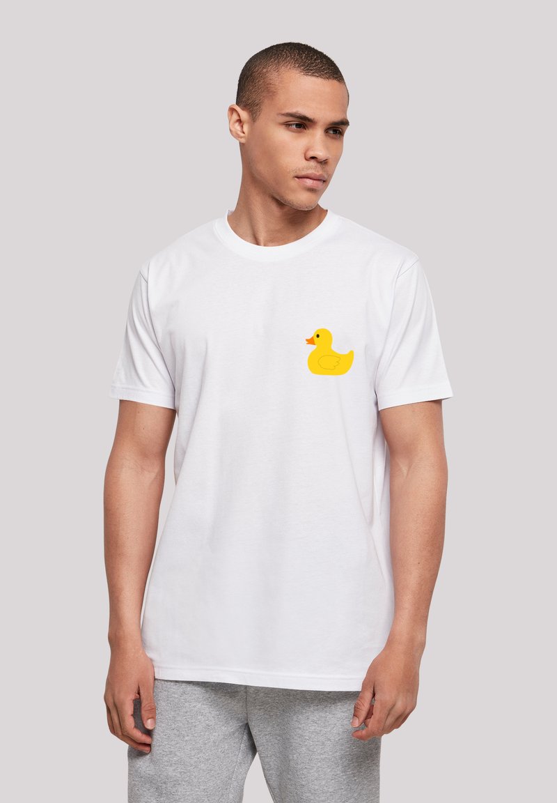 White cotton t-shirt featuring a yellow rubber duck graphic on the left chest. Short sleeves and a round neckline.