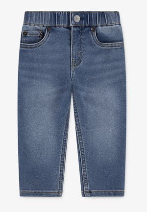 Blauwe spijkerbroek met een elastische tailleband, ontwerp met vijf zakken en gele stikseldetails; taps toelopende pijpvorm, gladde textuur.