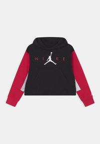 Felpa cropped nera e rossa con maniche lunghe, tasca frontale, logo Jumpman bianco e testo "NIKE" rosso sul petto.