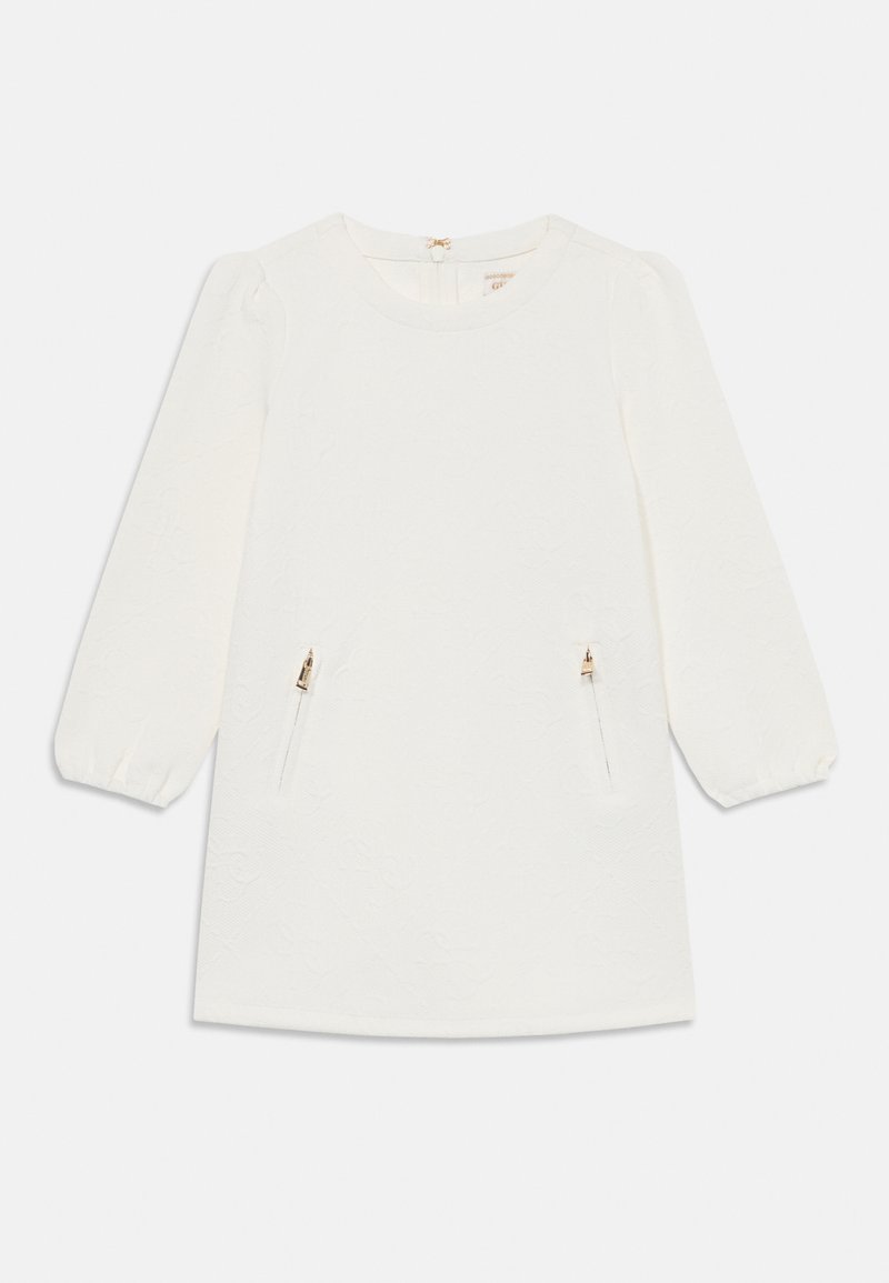 Balta suknelė su ilgomis pūkuotomis rankovėmis, tekstūruotu audiniu ir dviem priekinių kišenėmis su užtrauktukais. Apvalus iškirpimas su mažu mazgo uždarymu gale.