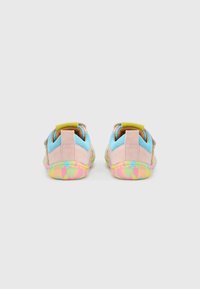 Multicolored shoes featuring a pink suede upper, blue mesh accents, and a tie-dye patterned sole in pastel hues. Two heel tabs for easy wear.