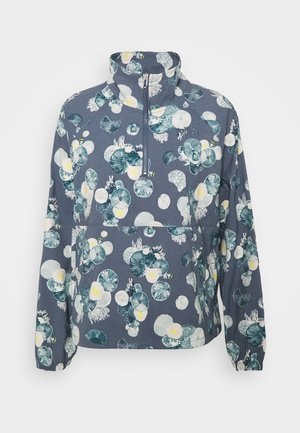 Floral vest met rits in donkerblauw, met grote groene en witte bloempatronen, een hoge kraag en elastische manchetten voor comfort.