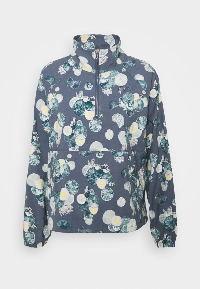 Florales Zip-up Sweatshirt in Dunkelblau mit großen grünen und weißen Blumenmustern, einem hohen Kragen und elastischen Bündchen für Komfort.