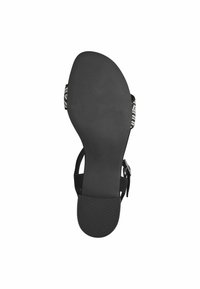 Sandalia negra con una suela texturizada y una correa decorativa. Presenta un diseño elegante con una plantilla suave y un cierre de hebilla. Talla 37.