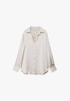 Chemise en satin beige clair à manches longues avec un col, un devant à boutons et une coupe décontractée. Texture douce, ourlet légèrement incurvé.