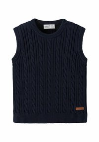 Suéter sin mangas de color navy, hecho de un tejido de punto texturizado con un patrón de trenzas. Presenta un cuello y dobladillo acanalados, con una pequeña etiqueta de la marca.