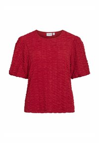 Petit haut à manches courtes rouge avec des détails de fronces texturés, col rond et coupe décontractée. Fabriqué en tissu léger. Étiquette de marque visible.